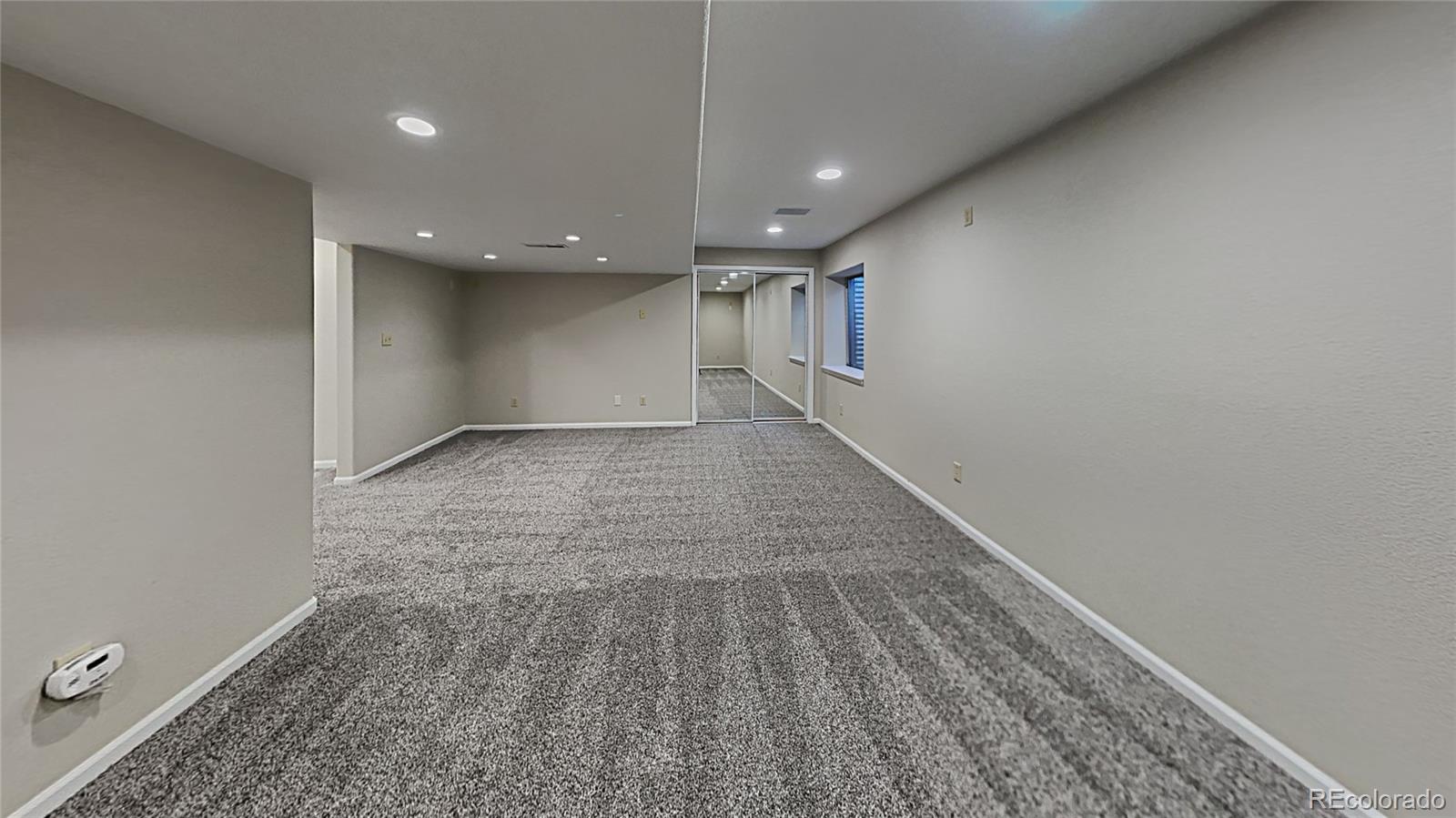 8774 Forrest Court Highlands Ranch, CO 80126 - Photo 27 of 31 a view of hallway with stairs