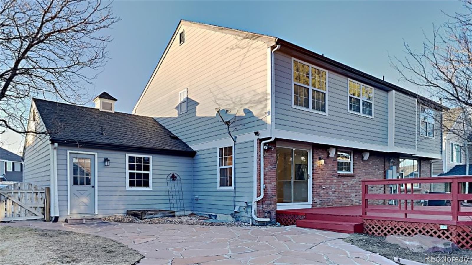 8774 Forrest Court Highlands Ranch, CO 80126 - Photo 28 of 31 a front view of a house with entryway