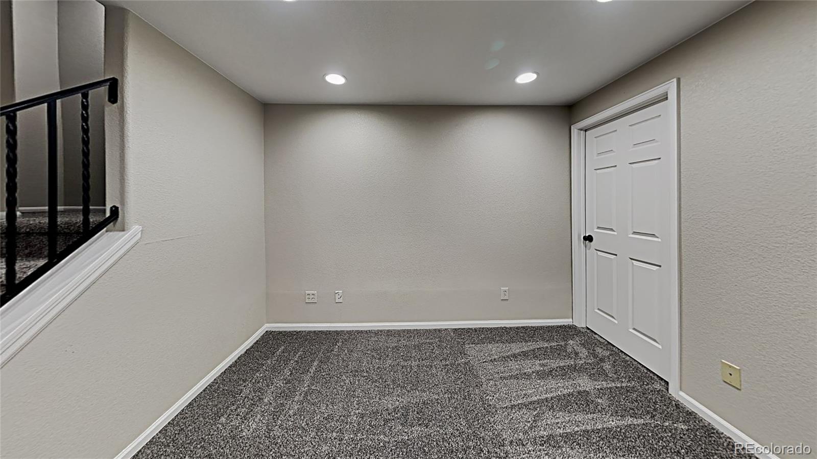 8774 Forrest Court Highlands Ranch, CO 80126 - Photo 4 of 31 wooden floor in an empty room