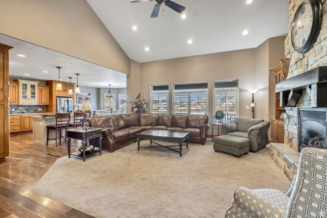 896 West 675 South Mapleton, UT 84664 - Photo 4 of 77 Living area with recessed lighting, high vaulted ceiling, a stone fireplace, light wood finished floors, and a ceiling fan