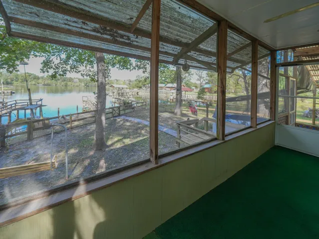 a view of a house with a backyard and porch