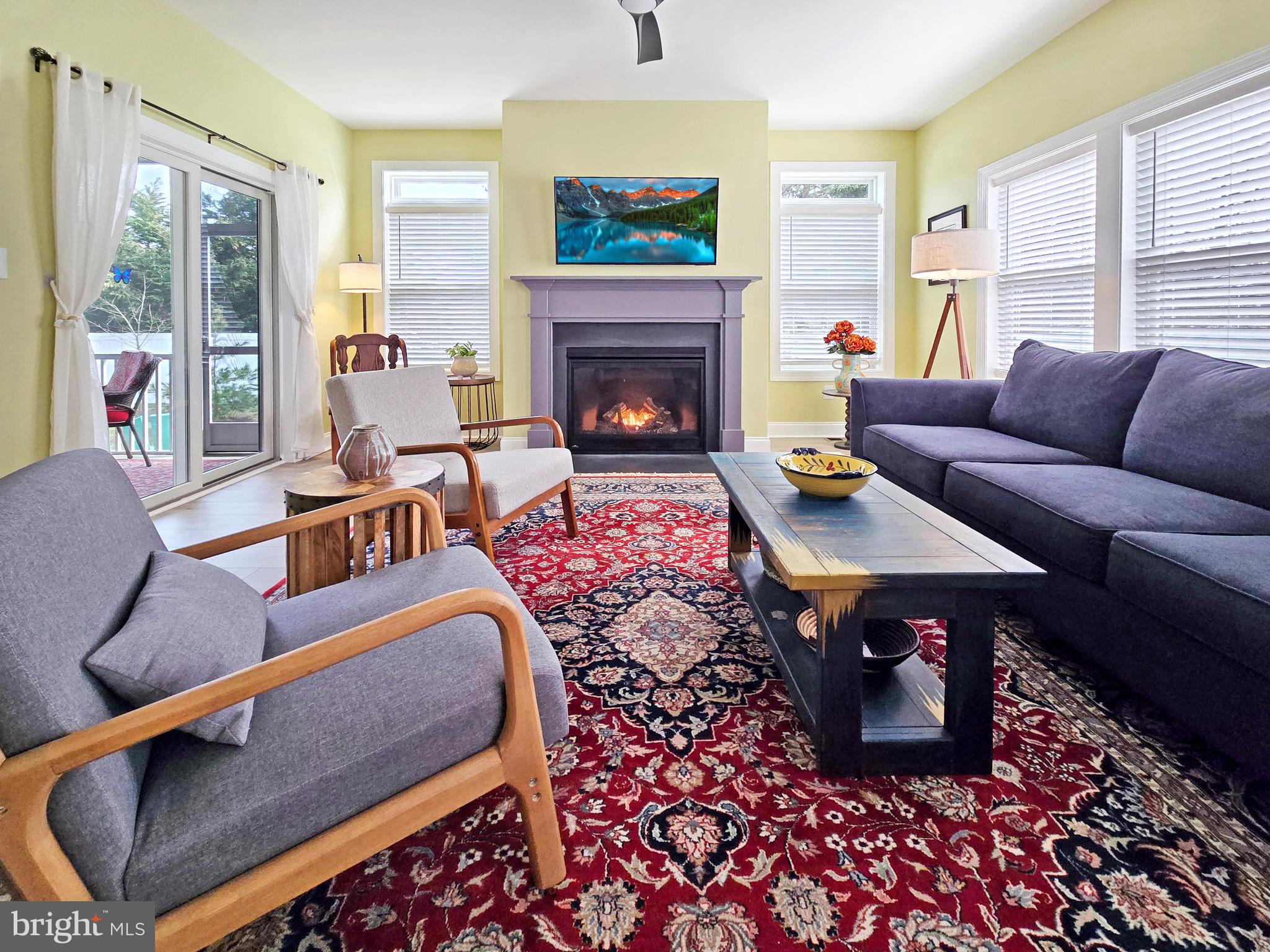 33768 Catching Cove Lewes, DE 19958 - Photo 16 of 69 a living room with furniture and a fireplace