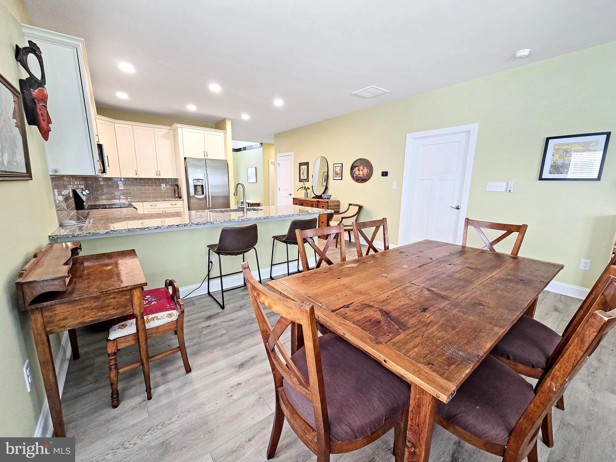 33768 Catching Cove Lewes, DE 19958 - Photo 19 of 69 a dining table and chairs in a room