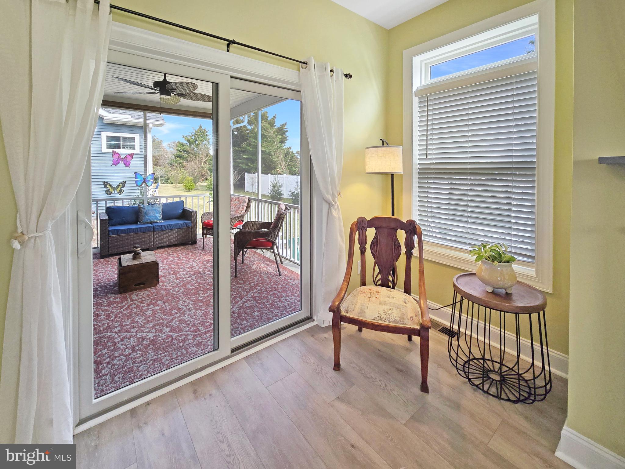 33768 Catching Cove Lewes, DE 19958 - Photo 20 of 69 a living room with furniture and a large window