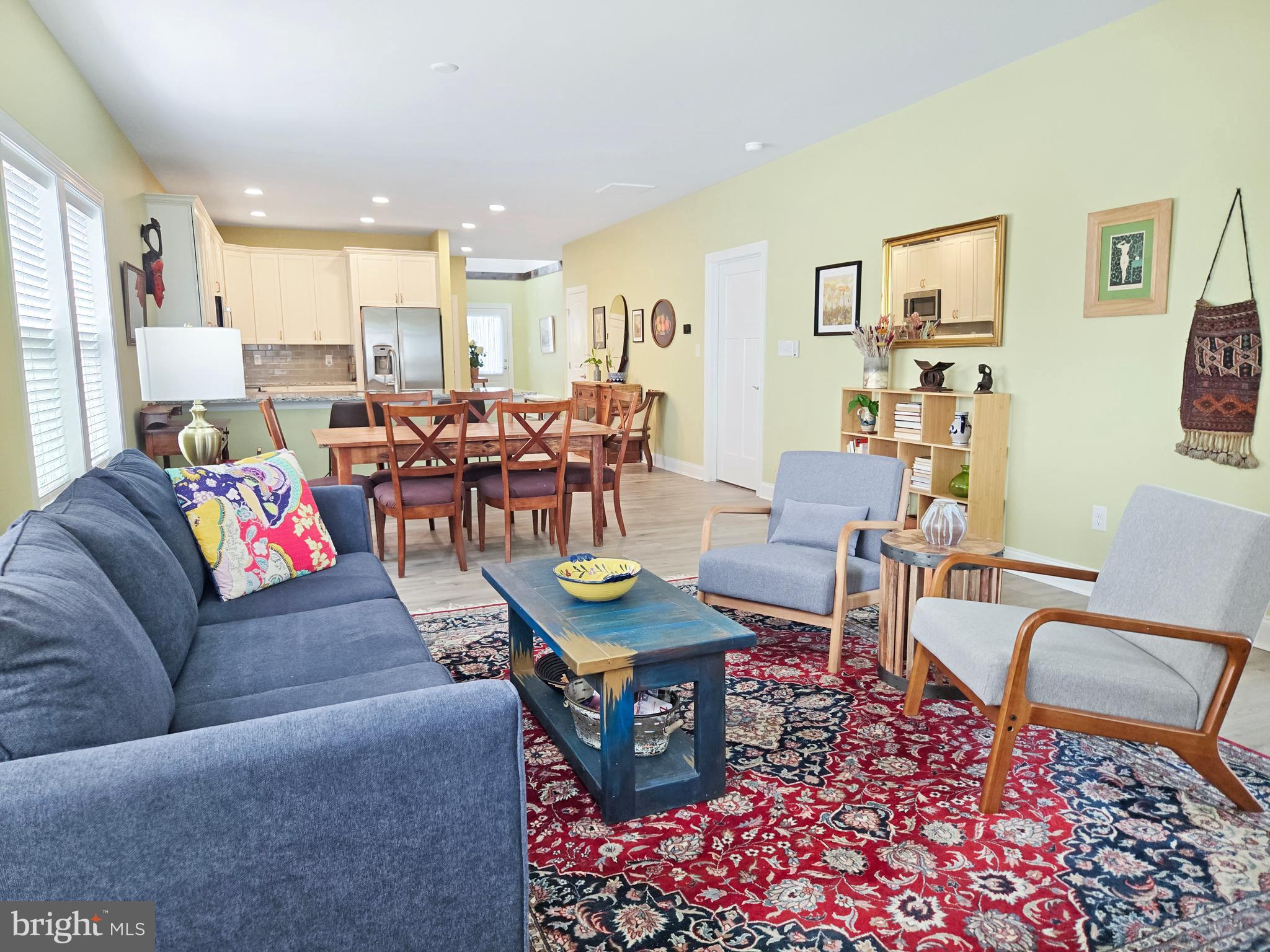 33768 Catching Cove Lewes, DE 19958 - Photo 25 of 69 a living room with furniture potted plant kitchen view and a window