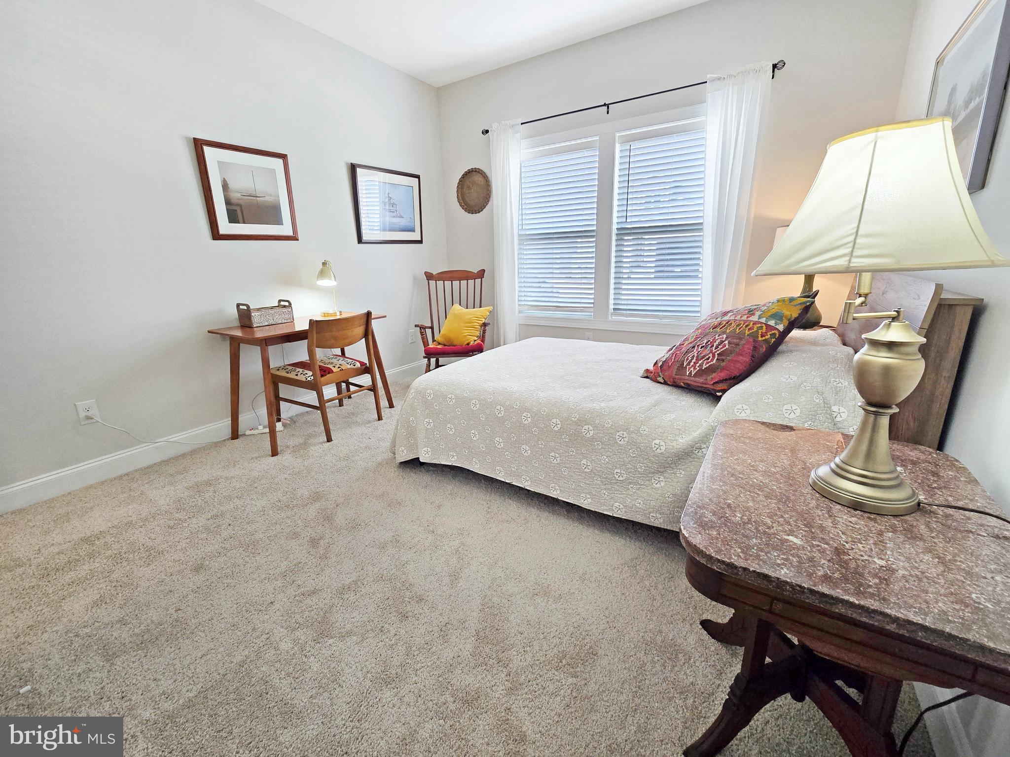 33768 Catching Cove Lewes, DE 19958 - Photo 28 of 69 a bedroom with a bed and window