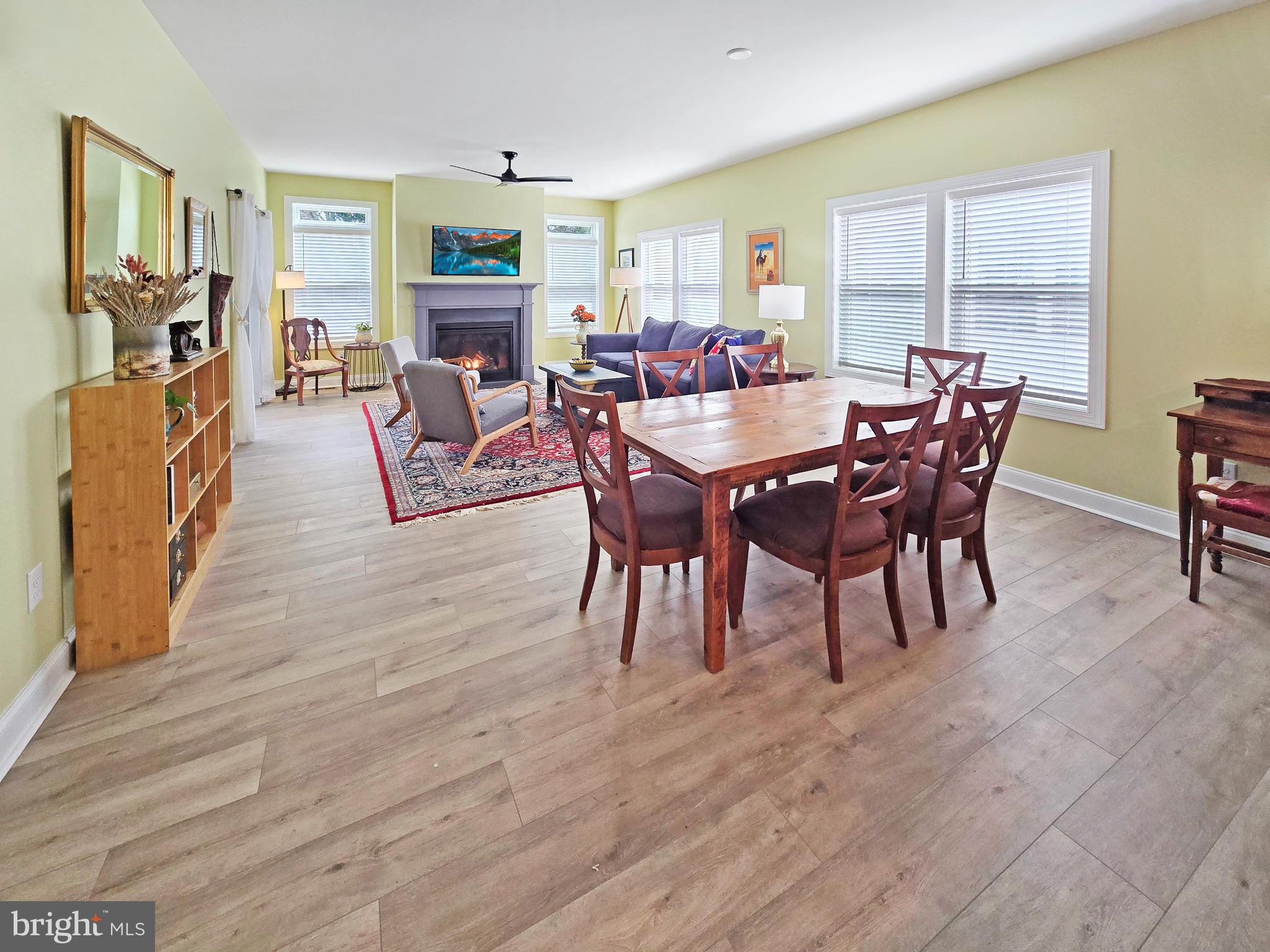 33768 Catching Cove Lewes, DE 19958 - Photo 3 of 69 a view of a dining room with furniture window and wooden floor