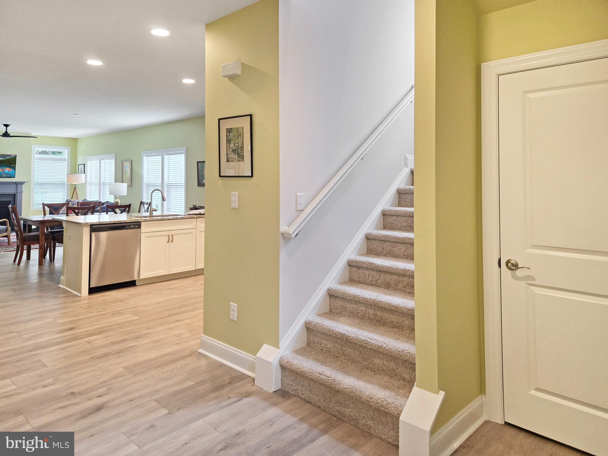 33768 Catching Cove Lewes, DE 19958 - Photo 31 of 69 a view of a kitchen with furniture and wooden floor