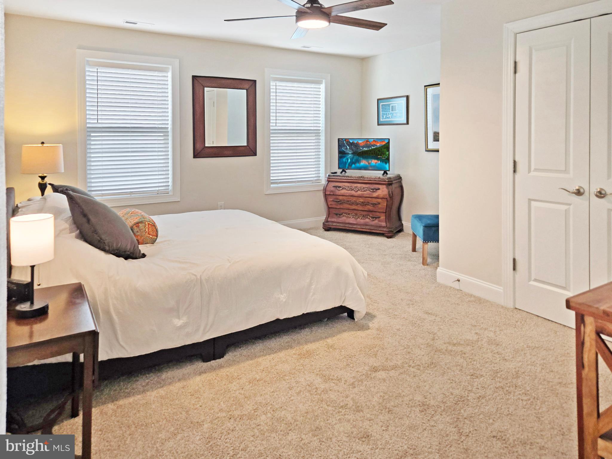 33768 Catching Cove Lewes, DE 19958 - Photo 33 of 69 a bedroom with a bed and window