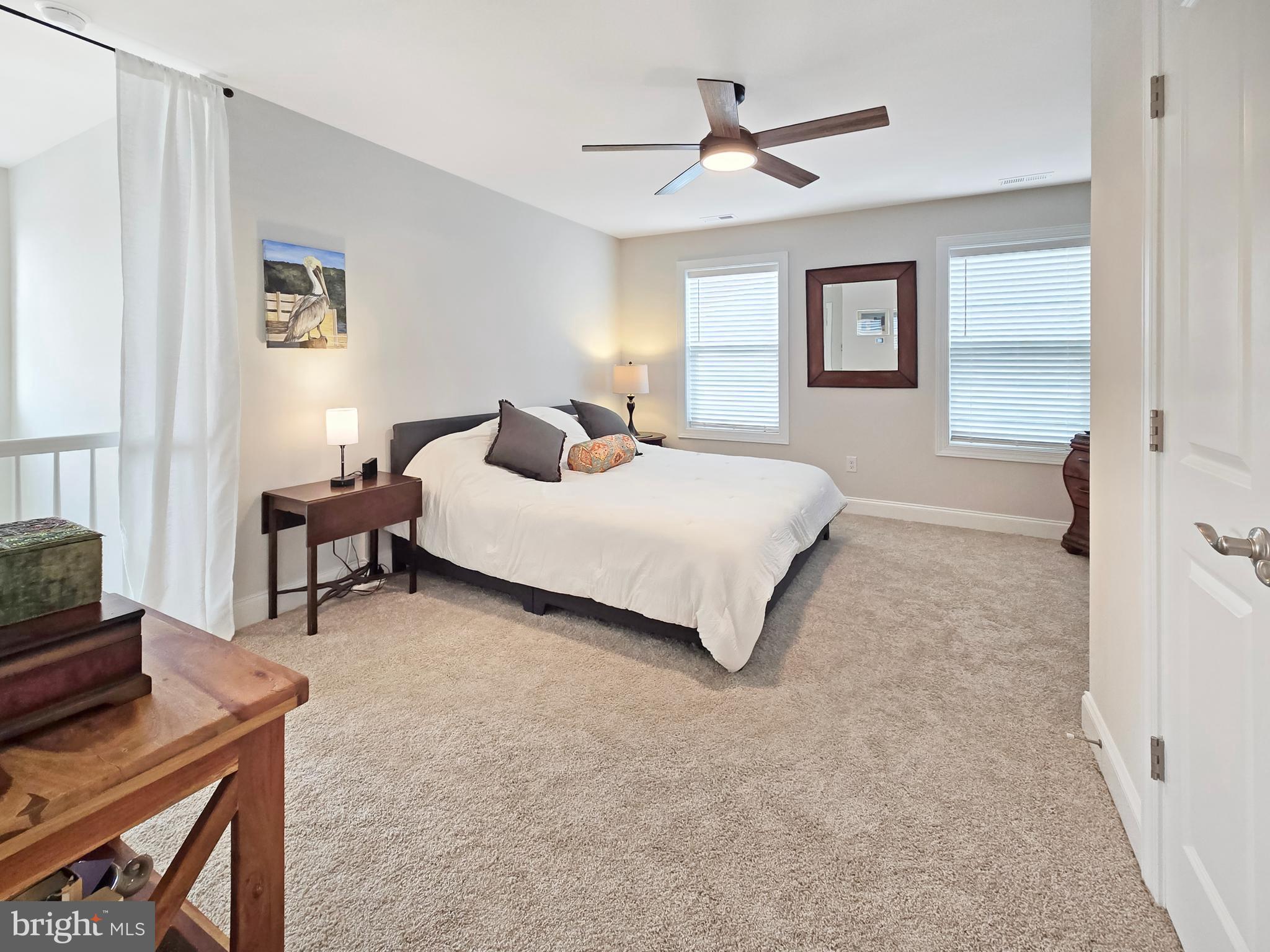 33768 Catching Cove Lewes, DE 19958 - Photo 34 of 69 a bedroom with a bed furniture and a window
