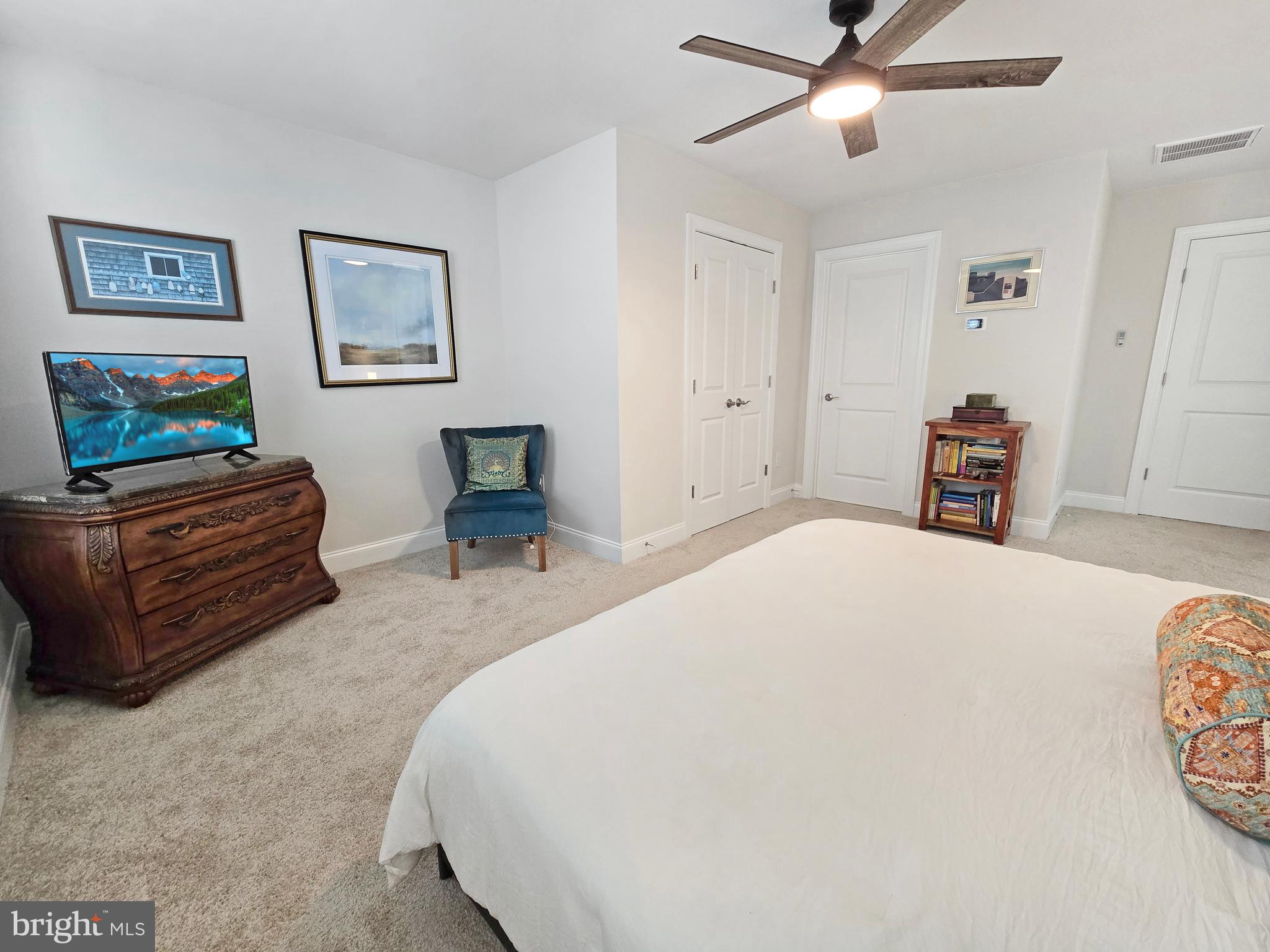 33768 Catching Cove Lewes, DE 19958 - Photo 35 of 69 a bedroom with a bed and dresser
