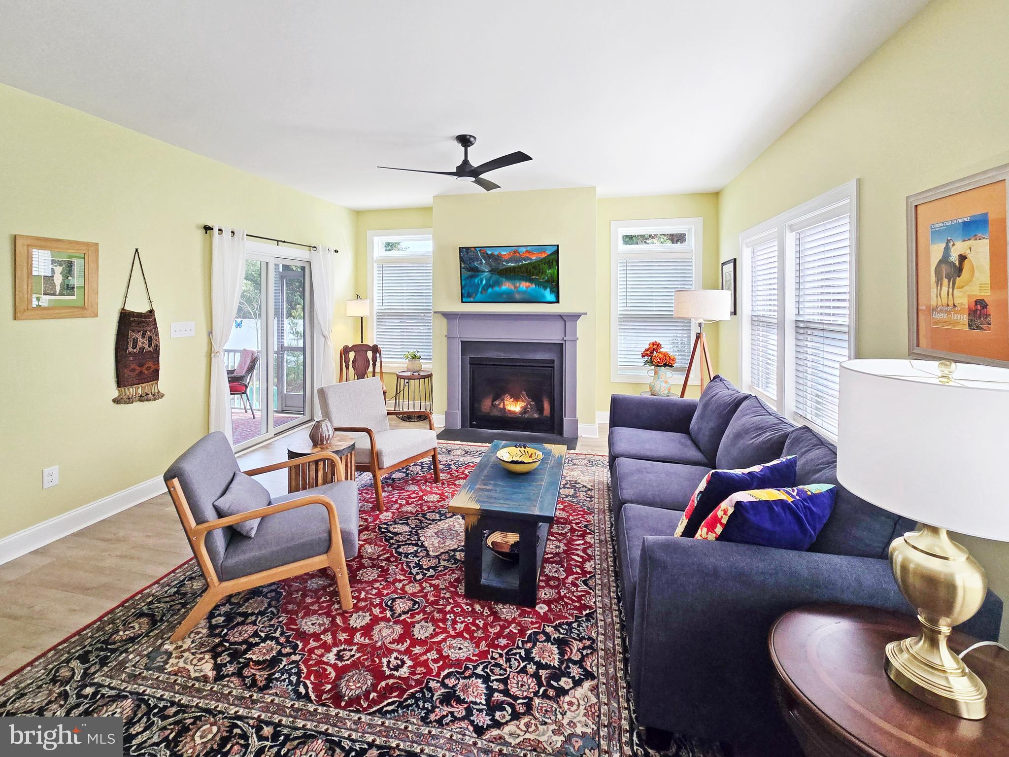 33768 Catching Cove Lewes, DE 19958 - Photo 4 of 69 a living room with furniture fireplace and wooden floor