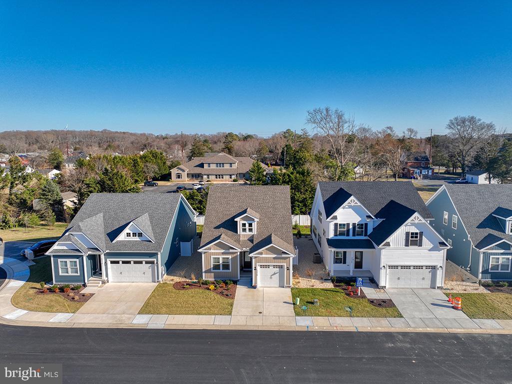 33768 Catching Cove Lewes, DE 19958 - Photo 48 of 69 an aerial view of residential houses and street