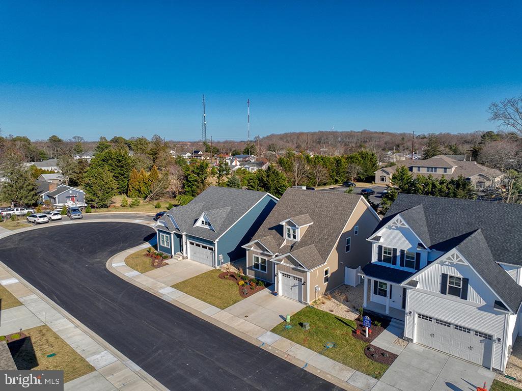 33768 Catching Cove Lewes, DE 19958 - Photo 49 of 69 an aerial view of a house with swimming pool and mountain view