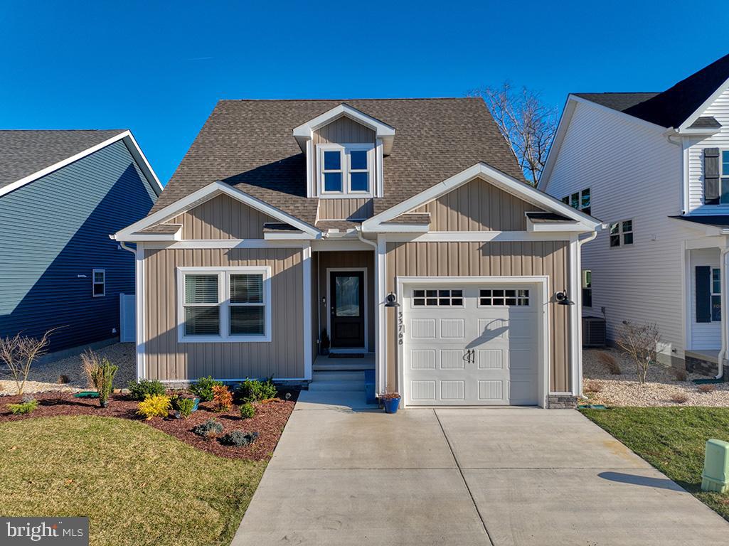 33768 Catching Cove Lewes, DE 19958 - Photo 59 of 69 a front view of a house with a yard
