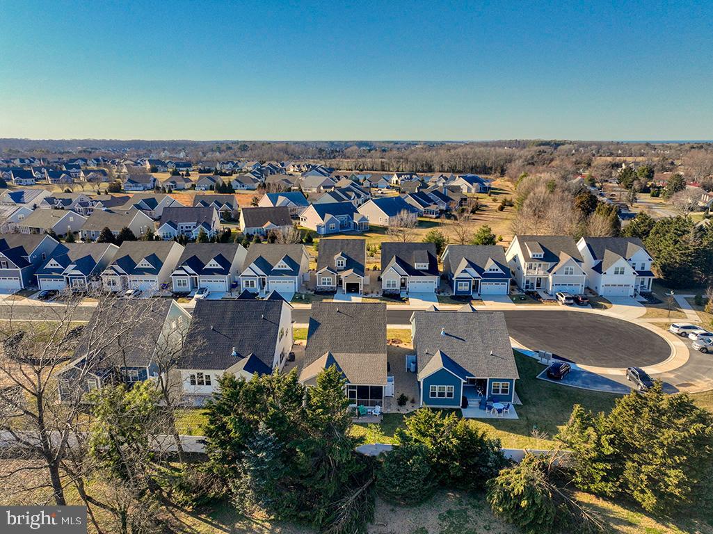 33768 Catching Cove Lewes, DE 19958 - Photo 60 of 69 an aerial view of a house with a swimming pool