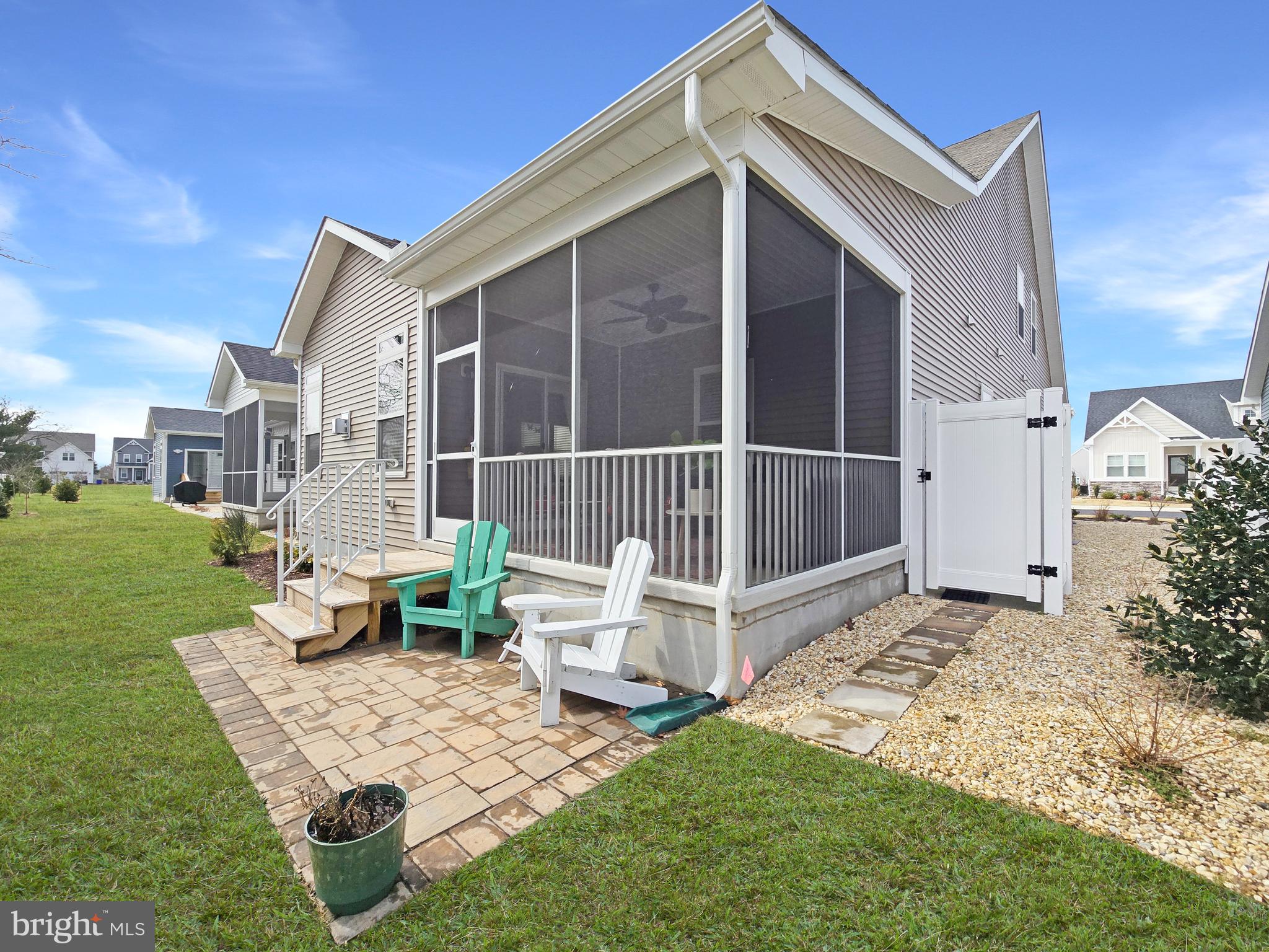 33768 Catching Cove Lewes, DE 19958 - Photo 6 of 69 a front view of a house with garden
