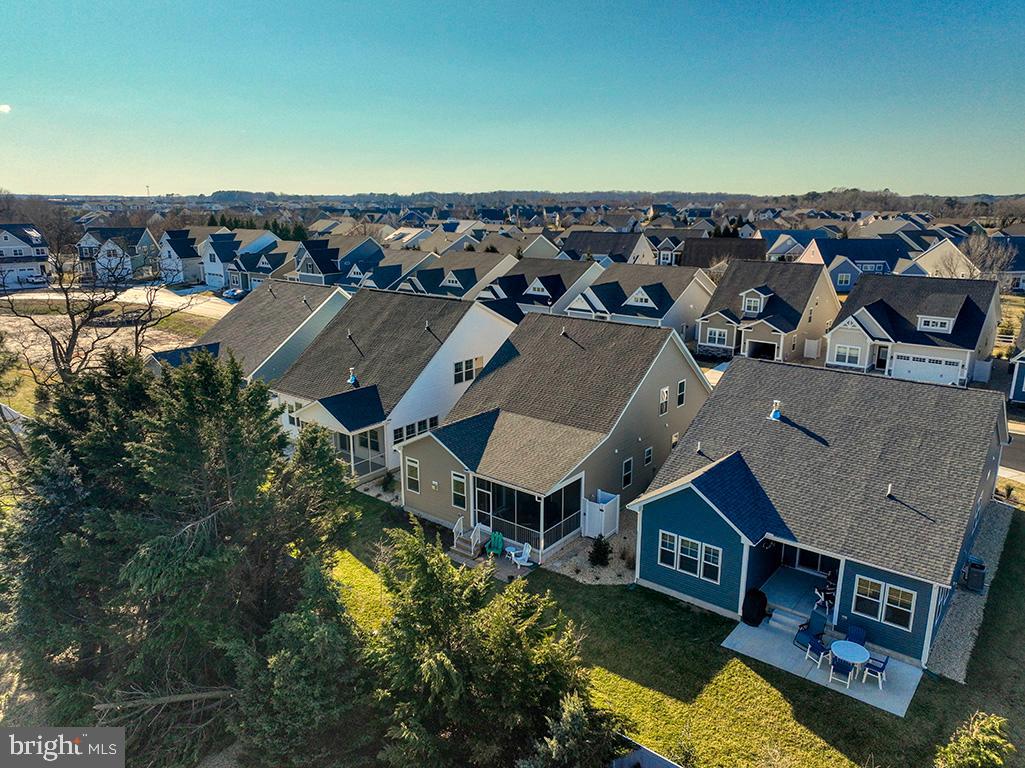 33768 Catching Cove Lewes, DE 19958 - Photo 62 of 69 an aerial view of a house with a yard