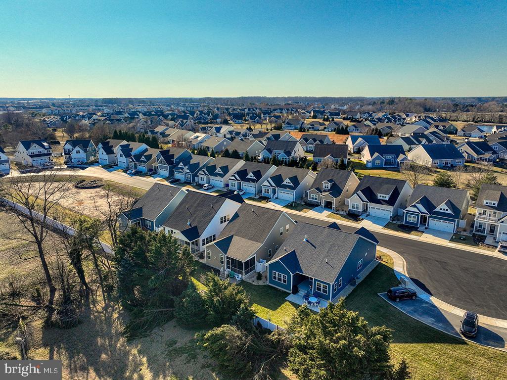 33768 Catching Cove Lewes, DE 19958 - Photo 64 of 69 an aerial view of a house with a swimming pool and outdoor space
