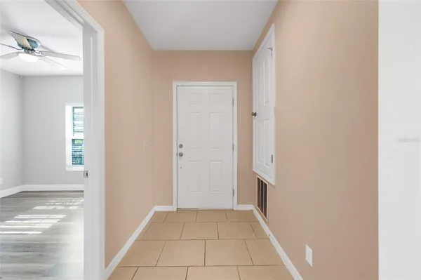 a view of a hallway to rooms
