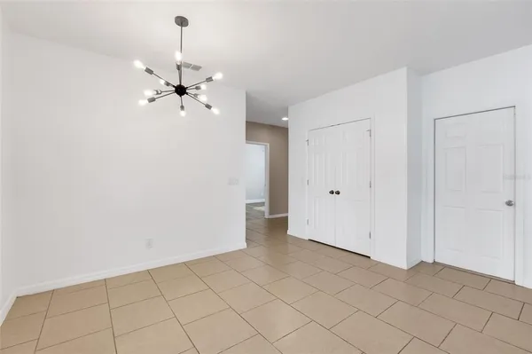 a kitchen with kitchen island granite countertop a refrigerator a sink and dishwasher