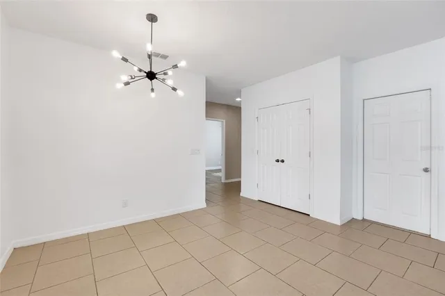 a kitchen with kitchen island granite countertop a refrigerator a sink and dishwasher