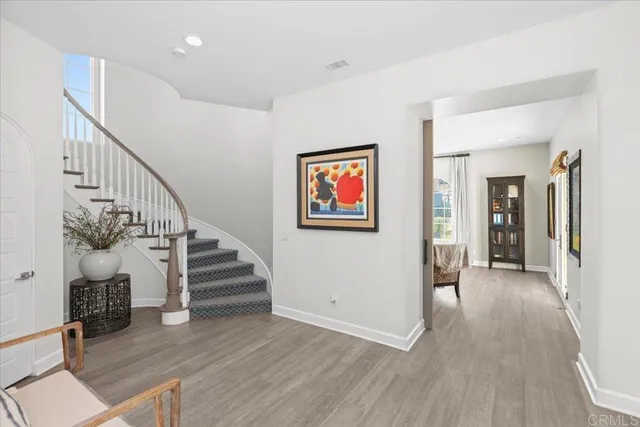 a living room with furniture pool table and a large window