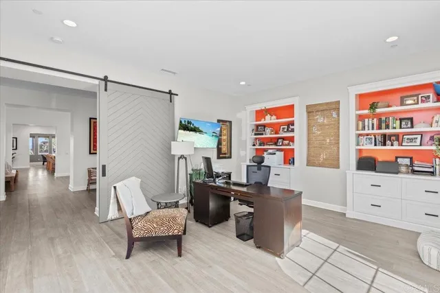 a large kitchen with a table and chairs