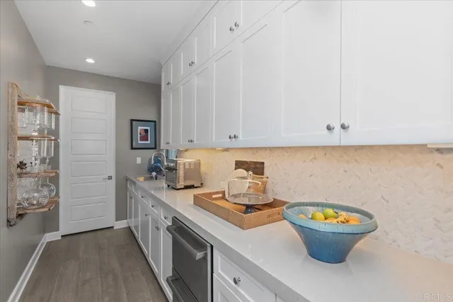 a living room with fireplace furniture and a large window
