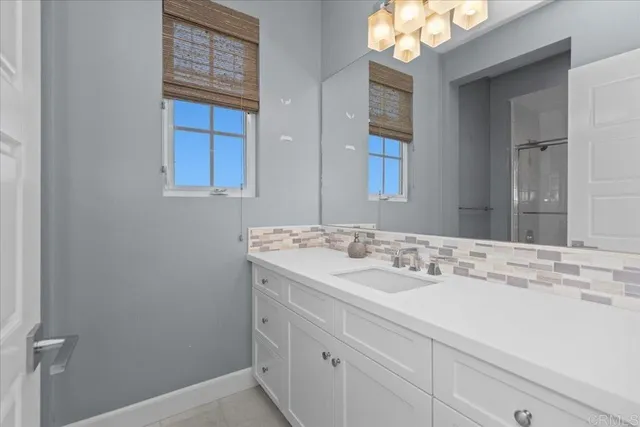 a spacious bedroom with a large bed and a large window