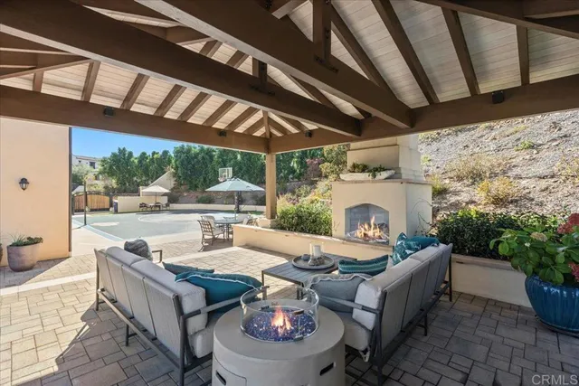 a front view of a building with cars parked