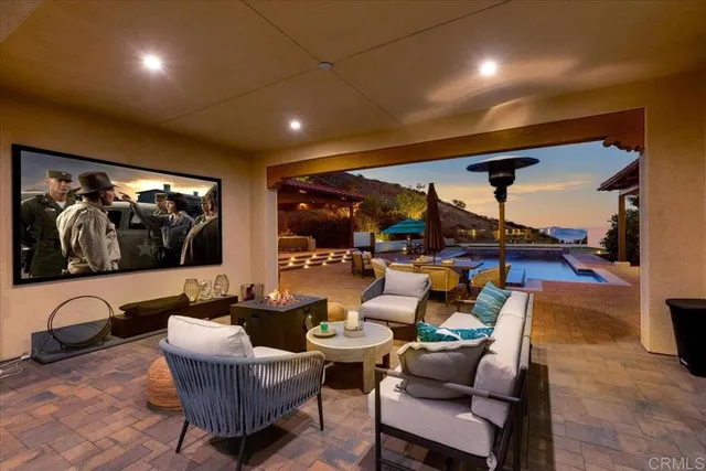 a view of a two chairs in the patio