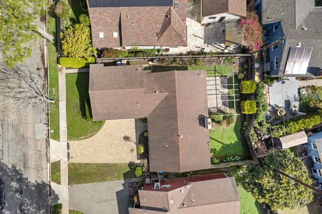 a aerial view of a house with a yard