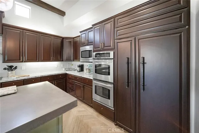 a view living room with kitchen island stainless steel appliances wooden floor and view living room