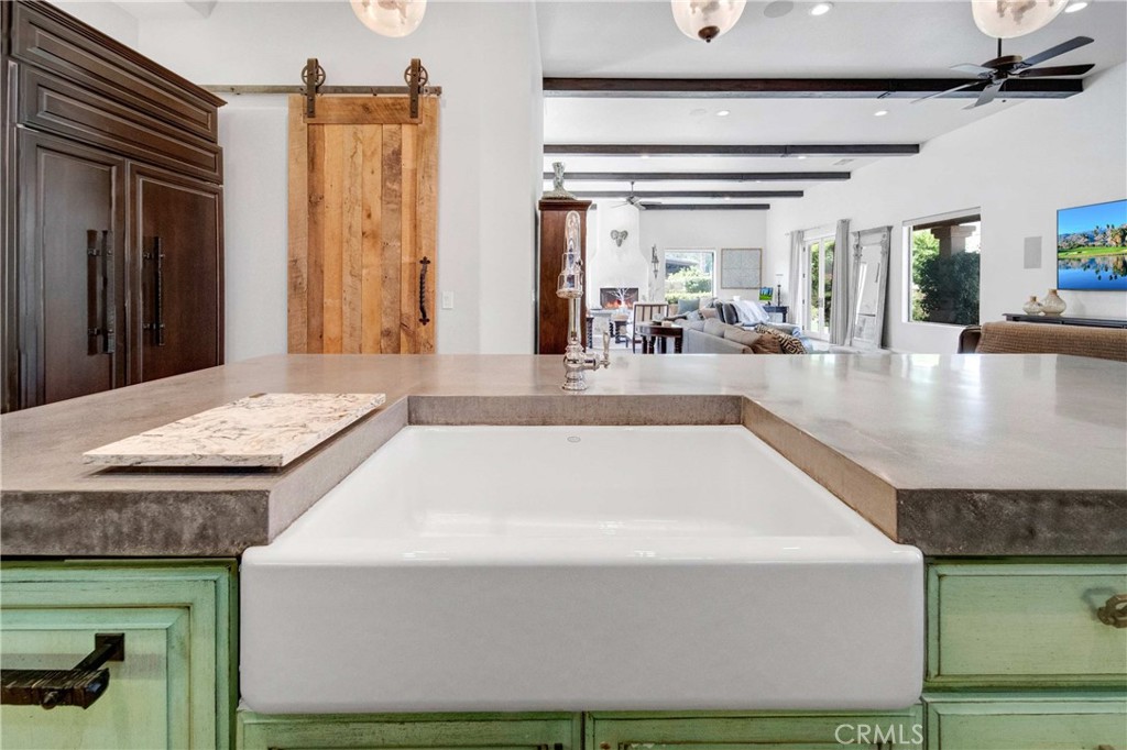 57721 Santa Rosa Trail La Quinta, CA 92253 - Photo 15 of 68 a view living room with kitchen island stainless steel appliances wooden floor and view living room