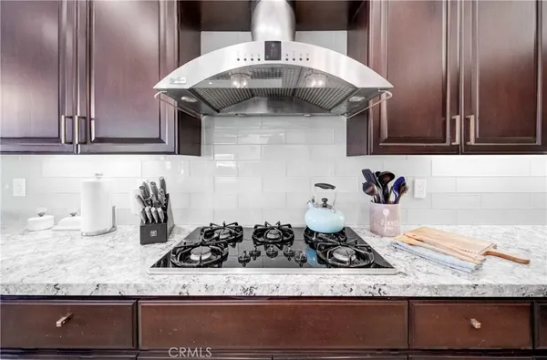 a bathroom with a granite countertop toilet a sink and bathtub