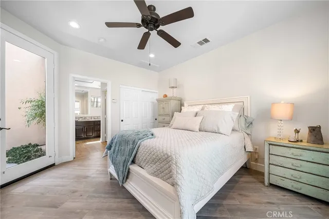 a view of a bedroom with a bed and a fireplace