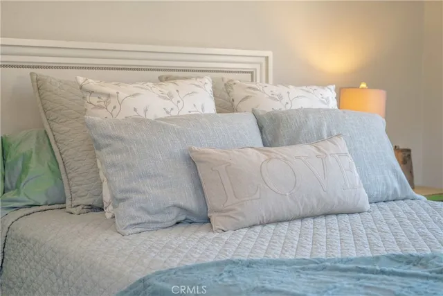 a bedroom with a bed and a fireplace