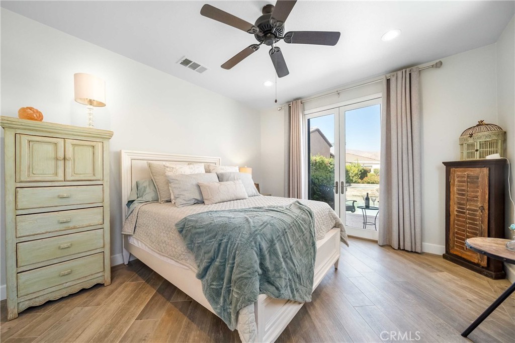 57721 Santa Rosa Trail La Quinta, CA 92253 - Photo 22 of 68 a bed room with a bed and a ceiling fan