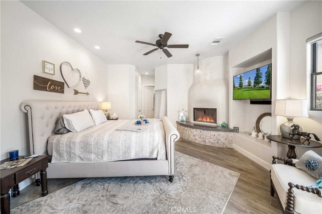 57721 Santa Rosa Trail La Quinta, CA 92253 - Photo 26 of 68 a bedroom with a bed couch tv and a window