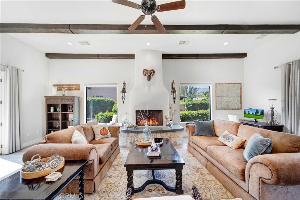 57721 Santa Rosa Trail La Quinta, CA 92253 - Photo 3 of 68 a living room with furniture and a fireplace