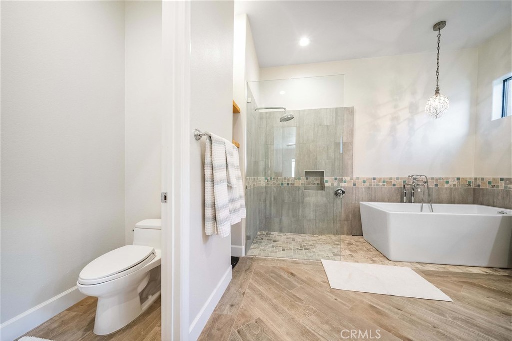 57721 Santa Rosa Trail La Quinta, CA 92253 - Photo 35 of 68 a bathroom with a bathtub a toilet a sink and shower
