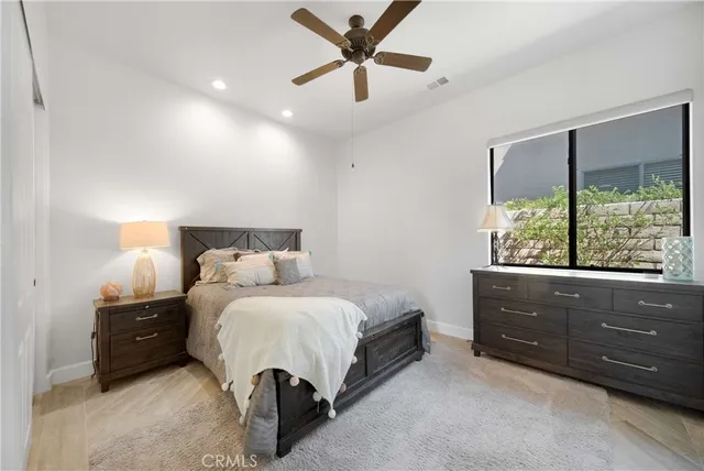 a white toilet sitting next to a white sink