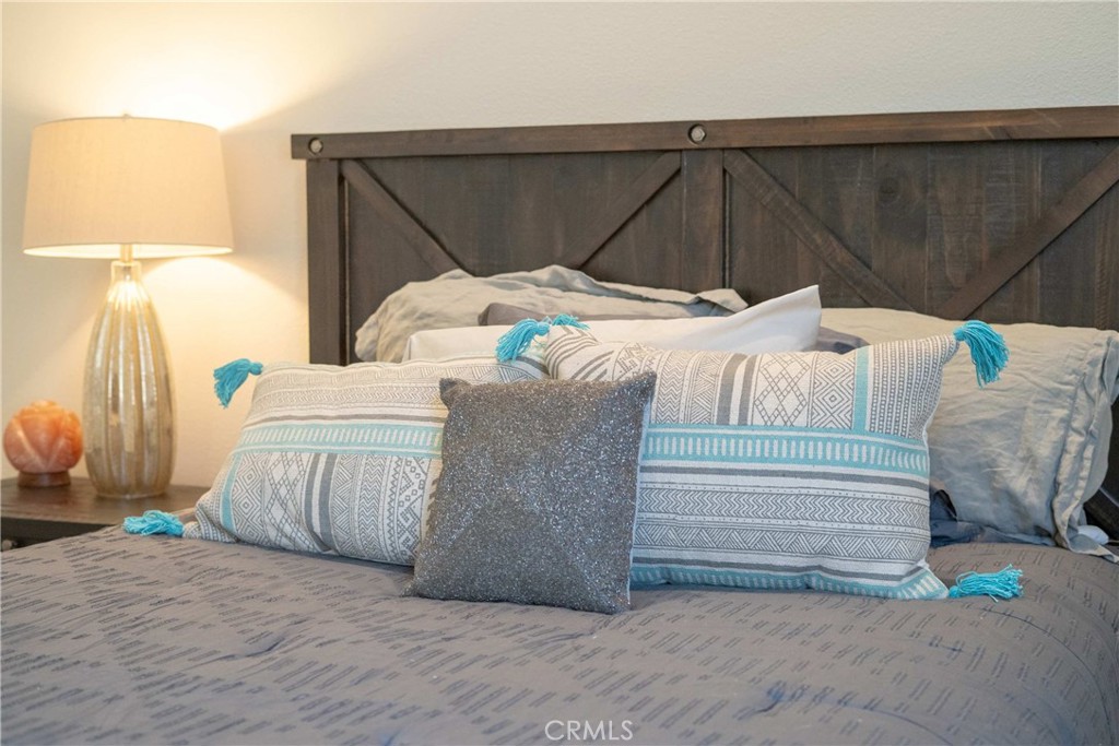 57721 Santa Rosa Trail La Quinta, CA 92253 - Photo 37 of 68 a bedroom with a bed and a chair