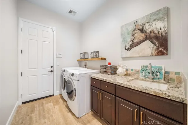 a view of a patio with table and chairs and potted plants