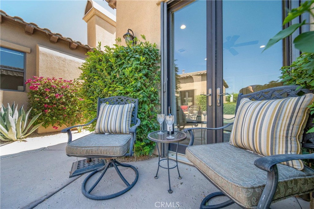 57721 Santa Rosa Trail La Quinta, CA 92253 - Photo 51 of 68 a view of a balcony with chairs and a potted plant