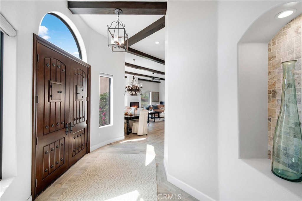 57721 Santa Rosa Trail La Quinta, CA 92253 - Photo 10 of 68 a view of a hallway with wooden shelves