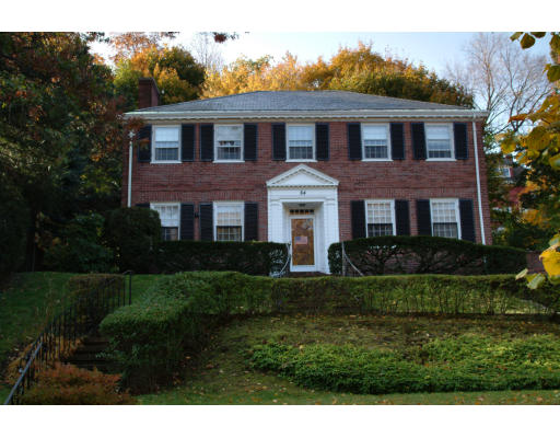84 Clinton Road Brookline, MA 02445 - Photo 1 of 1 a front view of a house with a yard