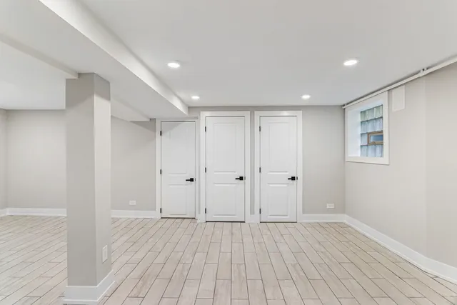 a room with a flat screen tv and a wall painting