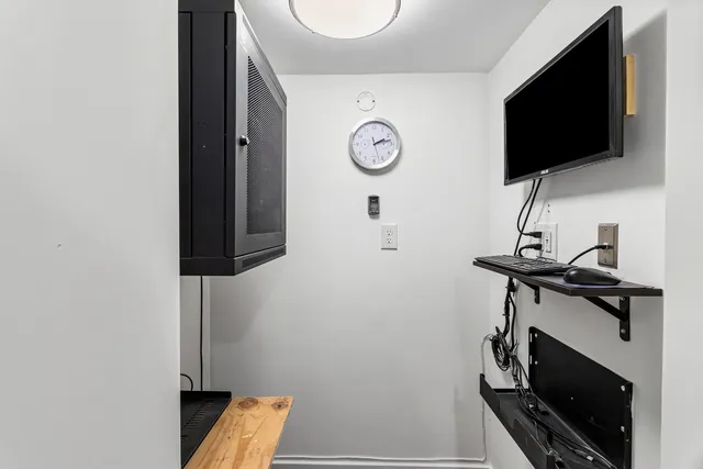 a bathroom with a sink vanity and a mirror